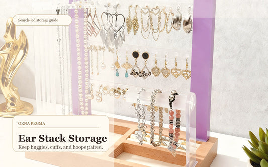 Huggie earrings, hoops, and ear cuffs organized on a jewelry display stand