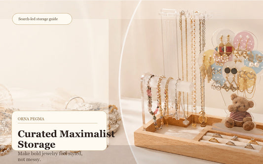 Curated maximalist jewelry displayed on an Orna Pegma organizer with earrings and necklaces visible