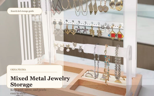 Gold and silver jewelry organized together on a clear jewelry organizer stand