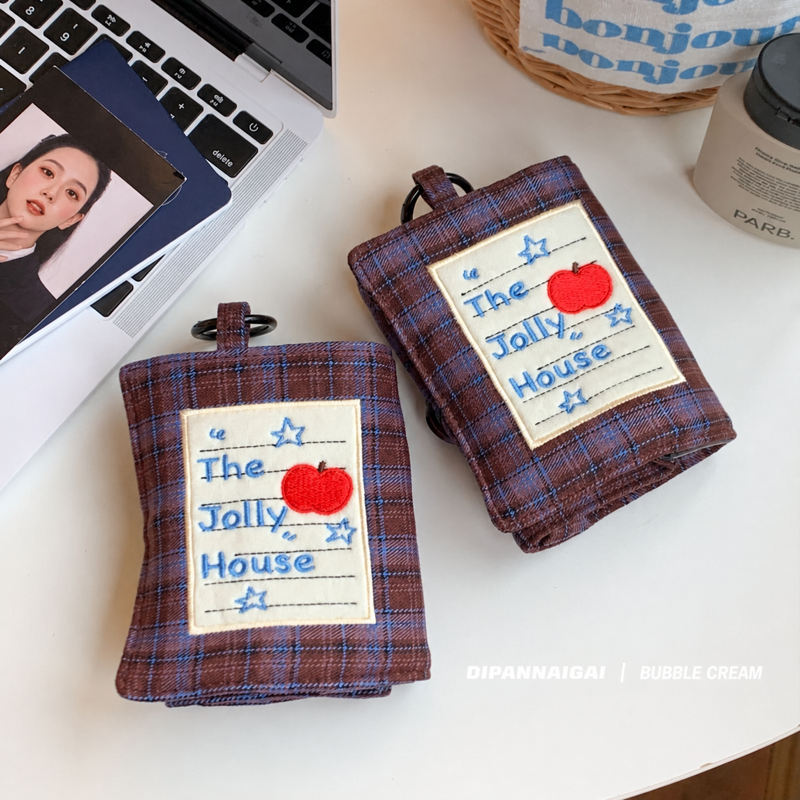 Two plaid jewelry cases displayed on a tabletop