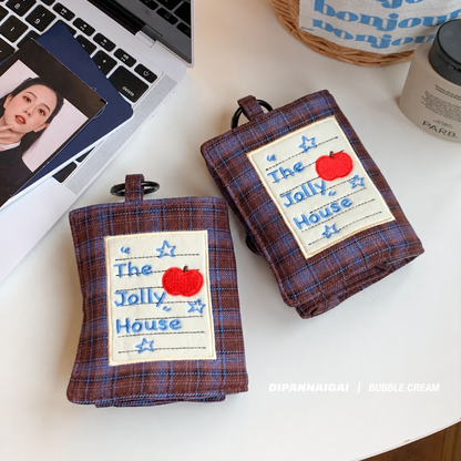 Two plaid jewelry cases displayed on a tabletop