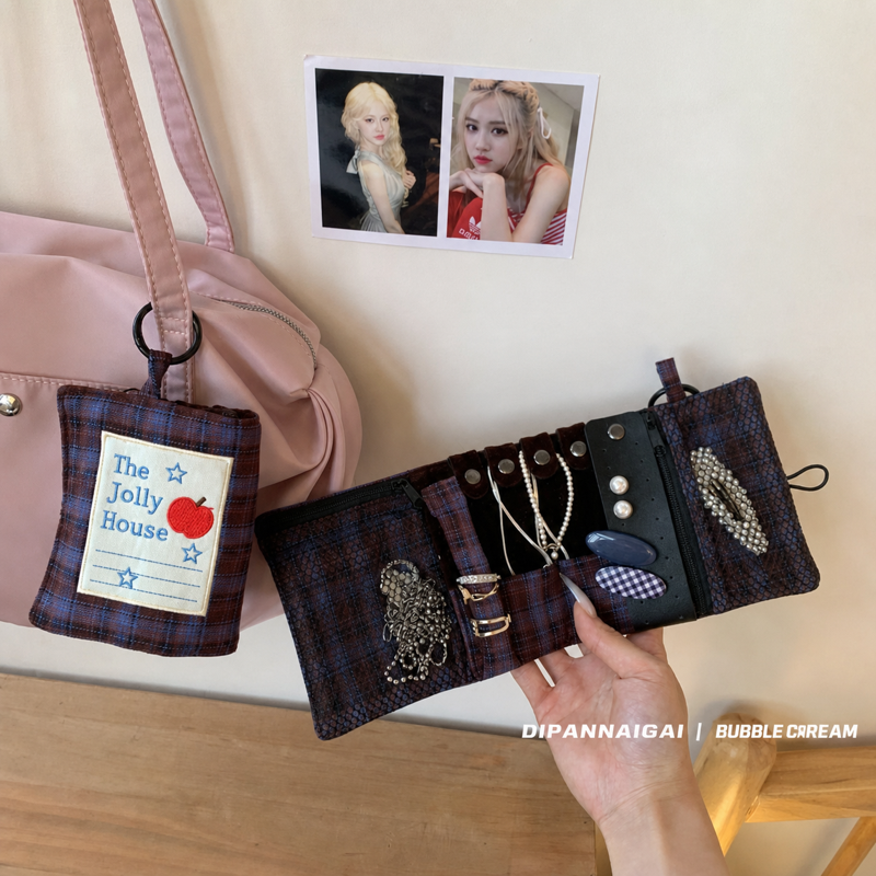 Open travel organizer attached to a pink handbag