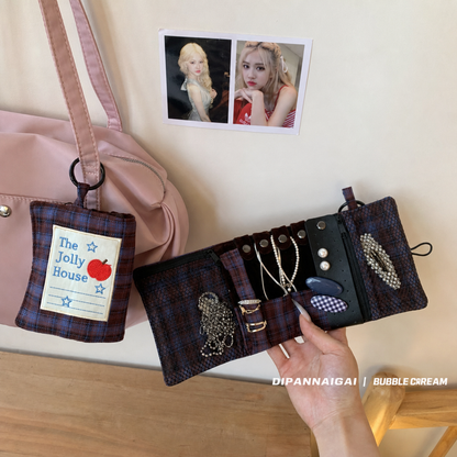 Open travel organizer attached to a pink handbag