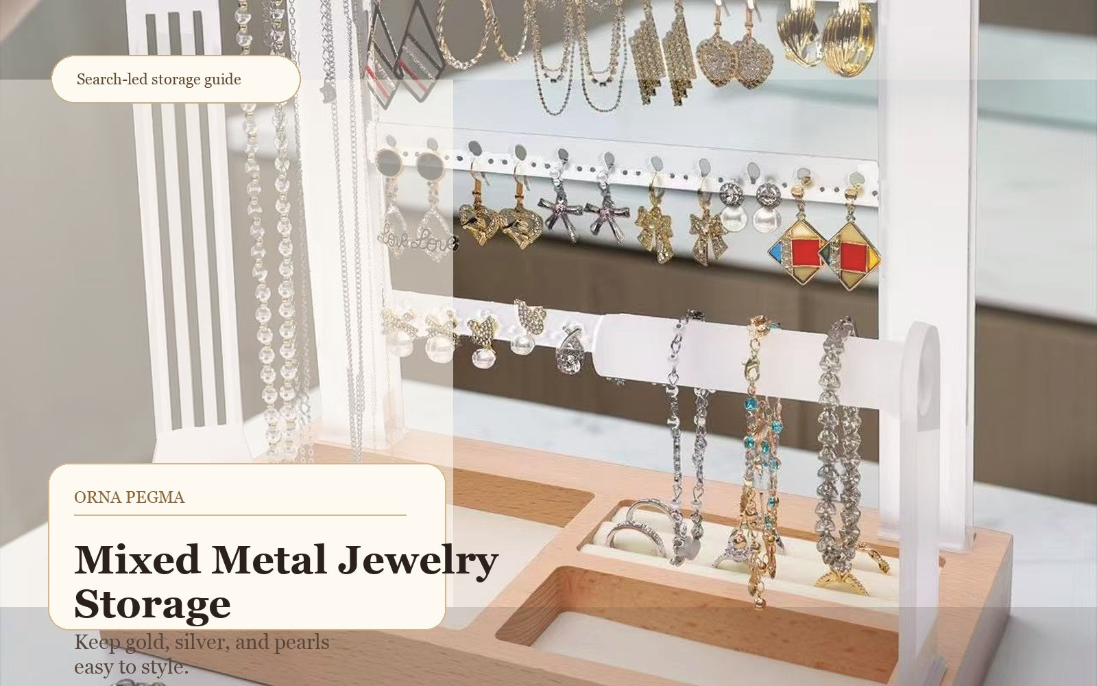 Gold and silver jewelry organized together on a clear jewelry organizer stand