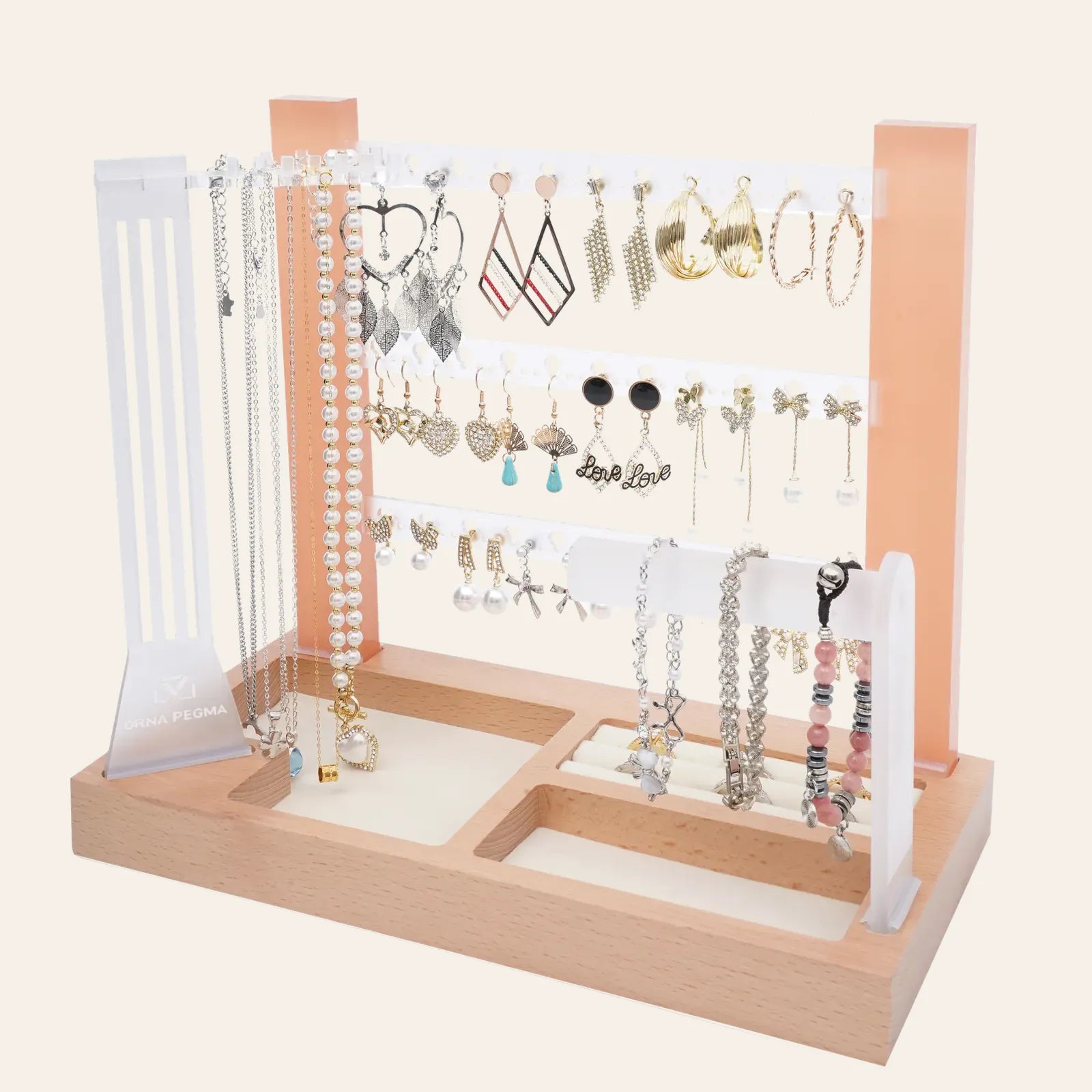 OrnaPegma acrylic and wood jewelry organizer displaying earrings, necklaces, rings, and bracelets